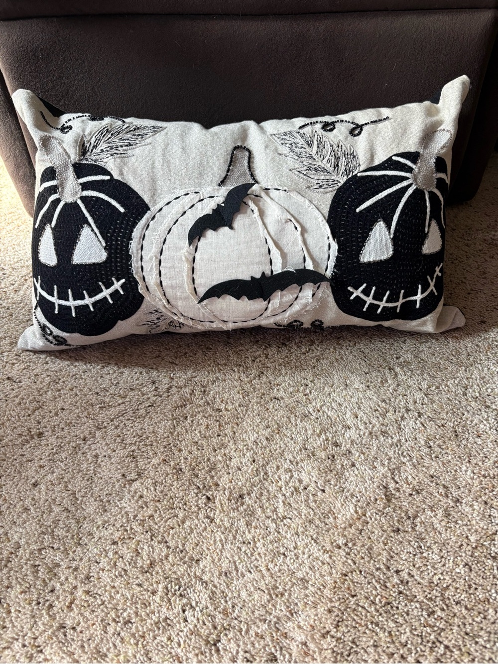 Appliquéd and sewn sparkle pumpkin pillow.